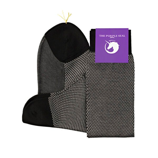 Fine classic style herringbone dress socks folded neatly on pure white surface as product image